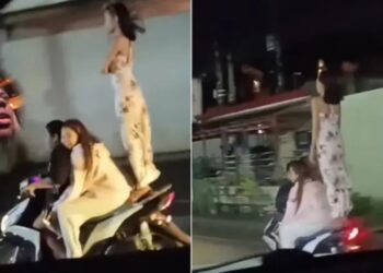 चलती स्कूटी पर अचानक खड़ी हो गई लड़की, बीच सड़क दिखाया दिल दहला देने वाला स्टंट