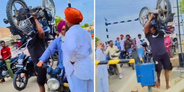 Viral: 100 किलो की बाइक कंधे पर यूं उठाकर पार की रेलवे क्रॉसिंग, शख्स का ‘बाहुबली’ अवतार देख हिल गए लोग!