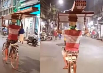 Viral Video: सिर पर सामान…बिना हैंडल पकड़े बंदे ने दिखाया गजब का टैलेंट, सड़क पर दिखाया बैलेंस का गजब खेल