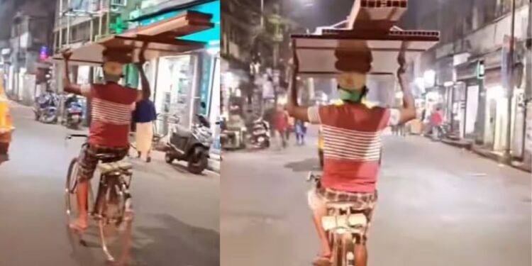 Viral Video: सिर पर सामान…बिना हैंडल पकड़े बंदे ने दिखाया गजब का टैलेंट, सड़क पर दिखाया बैलेंस का गजब खेल