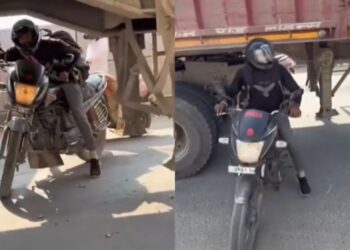 Viral Video: चालू ट्रक के बीच से निकलकर बंदे ने किया ऐसा कारनामा, वीडियो देख पक्का माथा पकड़ लेंगे आप
