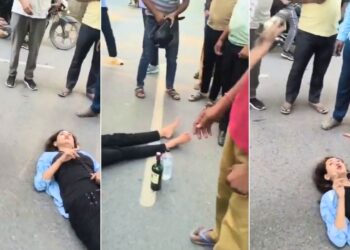 हाथ में सिगरेट, बगल में बोतल…ग्रेटर नोएडा की सड़क पर यूं लेटकर महिला ने किया हाई वोल्टेज ड्रामा; वीडियो वायरल