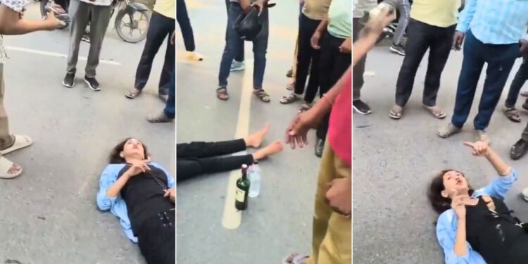 हाथ में सिगरेट, बगल में बोतल…ग्रेटर नोएडा की सड़क पर यूं लेटकर महिला ने किया हाई वोल्टेज ड्रामा; वीडियो वायरल