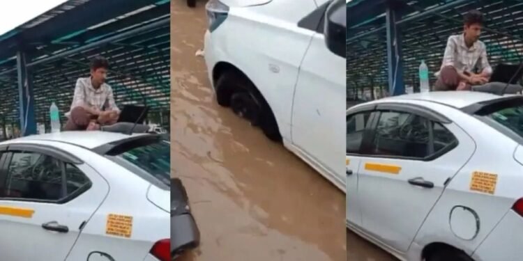 बारिश ने रोका रास्ता, लेकिन काम नहीं! कैब की छत पर बैठकर ऑफिस का काम करता दिखा शख्स, वीडियो ने दिखाई कॉरपोरेट जिंदगी की हकीकत